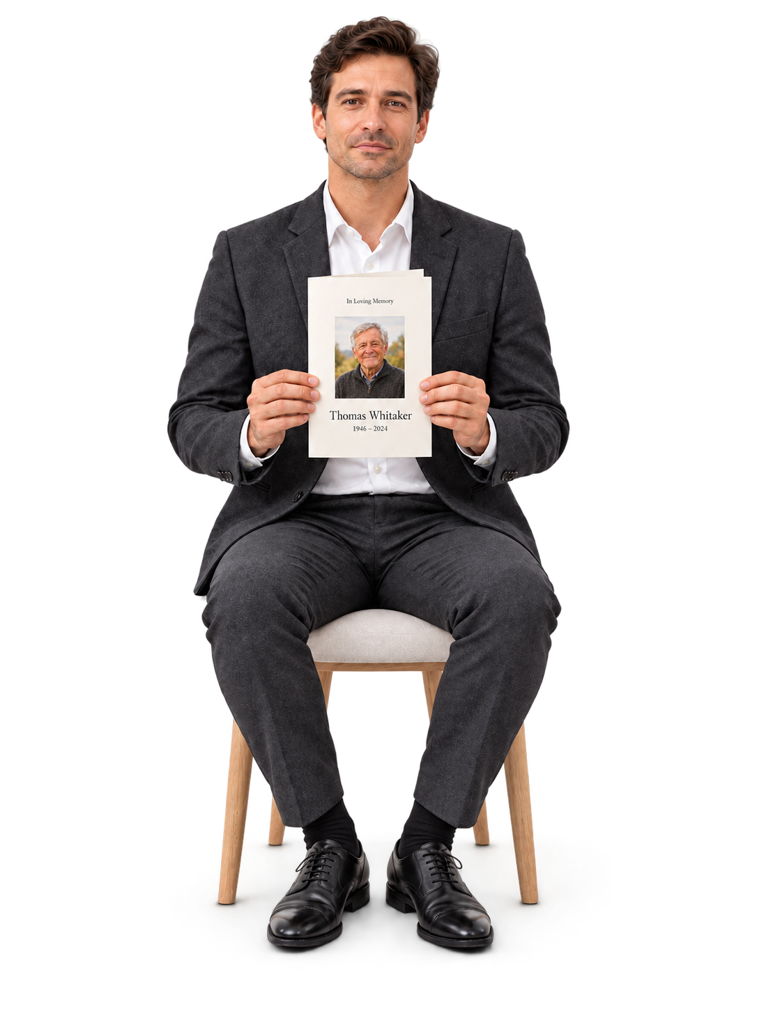 Man holding a printed memorial booklet